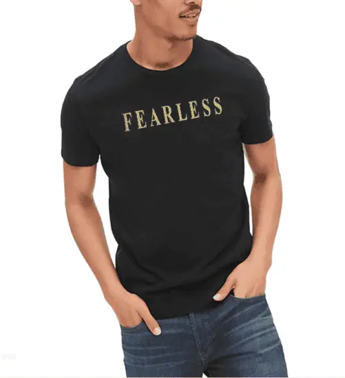 A man wearing a shirt with a text that says fearless