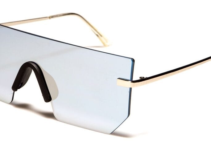 A Solid Glass Shaped Glasses With Gold Frame