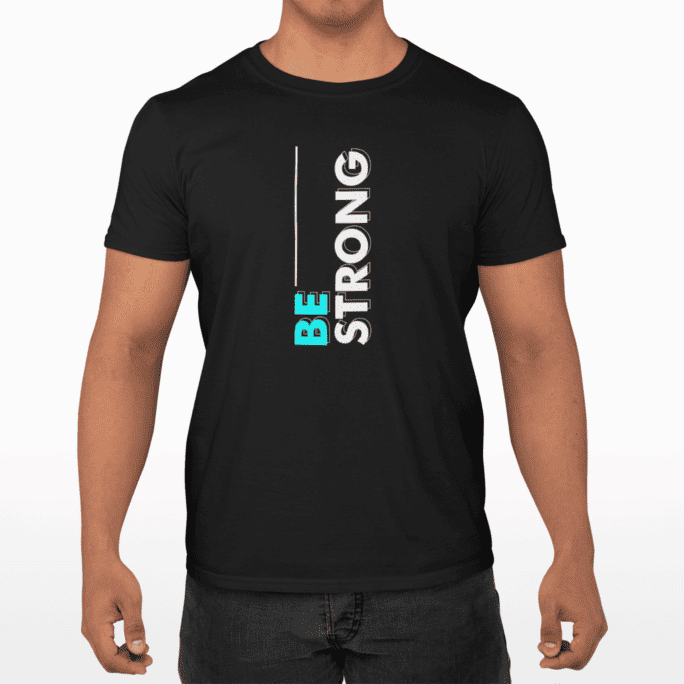 A man wearing a shirt with a text that says Be strong