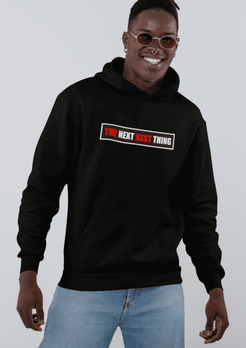 A man wearing a black hoodie with red and white text and a white background